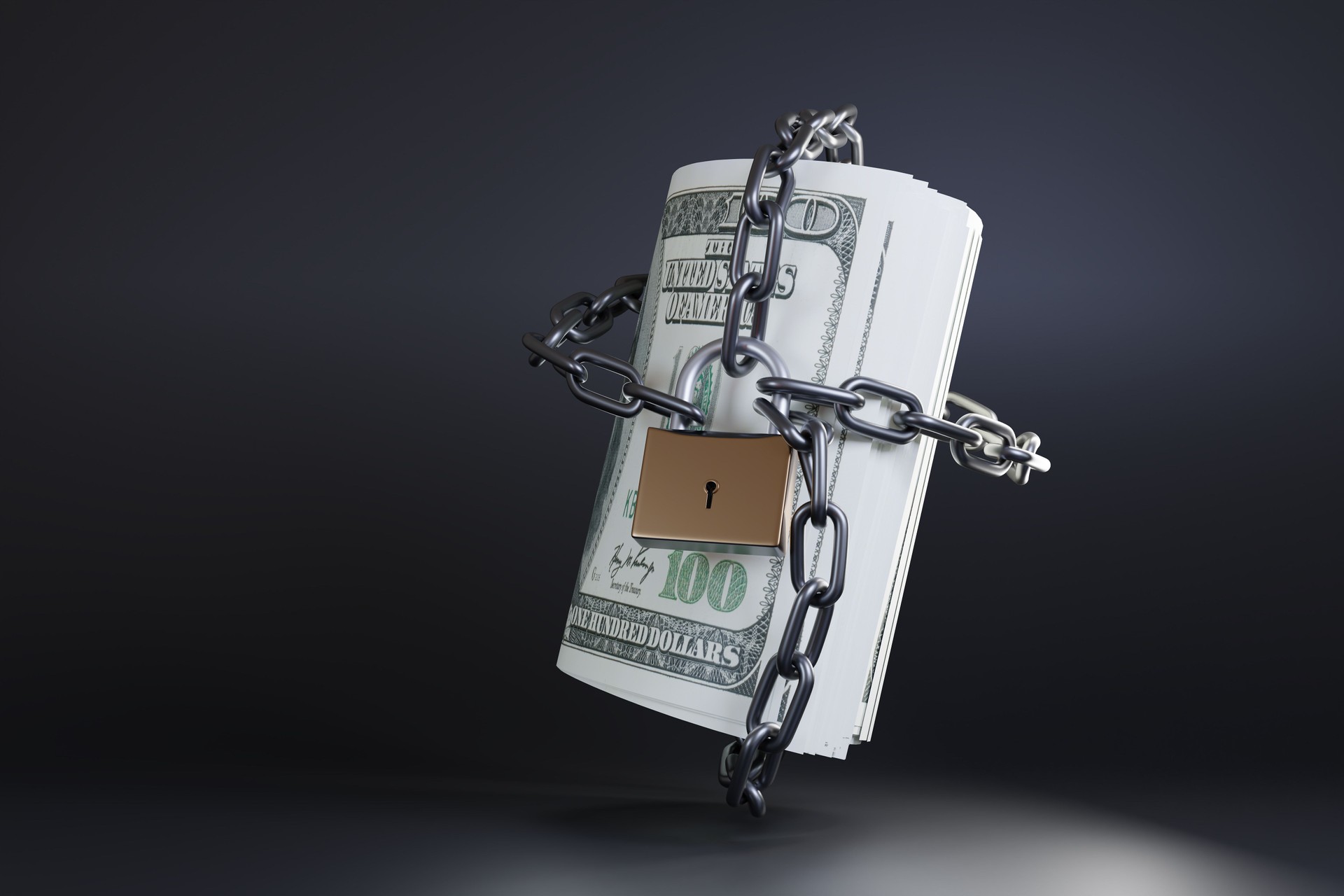 Padlock and a metal chain locking a roll of US banknotes on a black background. Illustration of the concept of wealth protection, debt and financial restriction